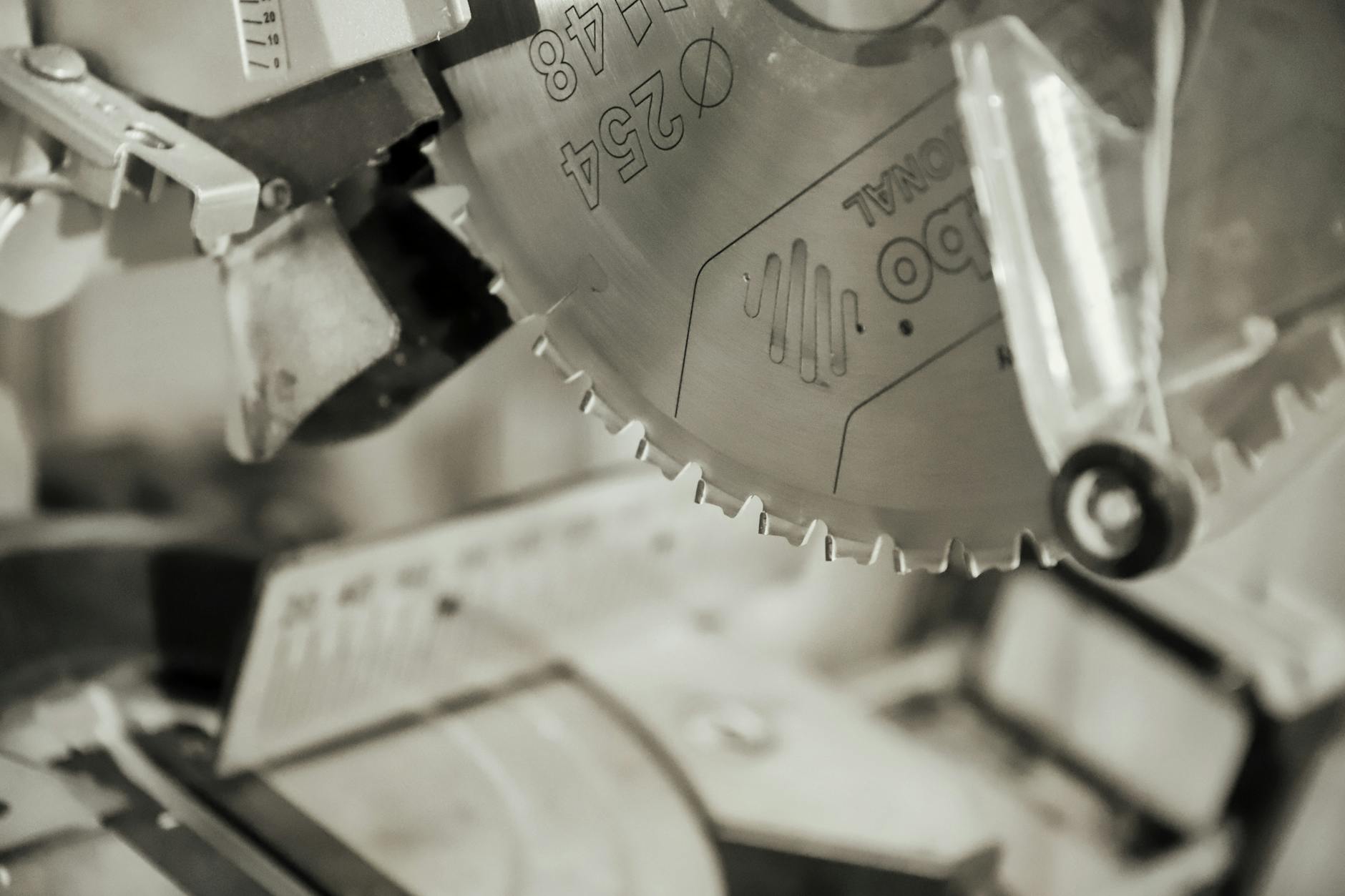 Detailed view of a circular saw blade in an industrial workshop